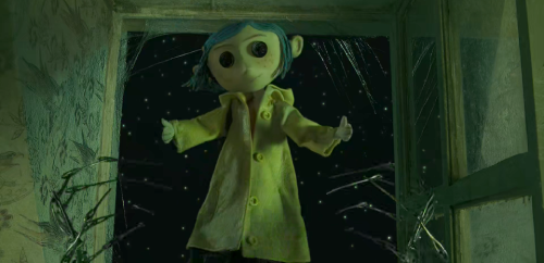 Thin metallic hands (made of sewing needles?) let go of a doll as it floats put a window. The doll is a girl, with blue hair, a yellow raincoat, and button eyes.